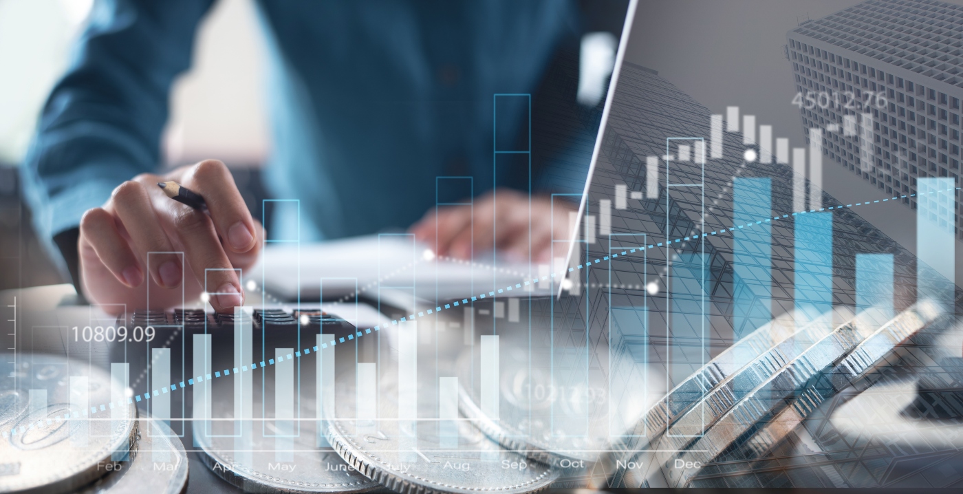 Person writing notes with a pen near a laptop, overlaid with financial graphs and coins, illustrating tax deductions and credits for small business owners and freelancers.